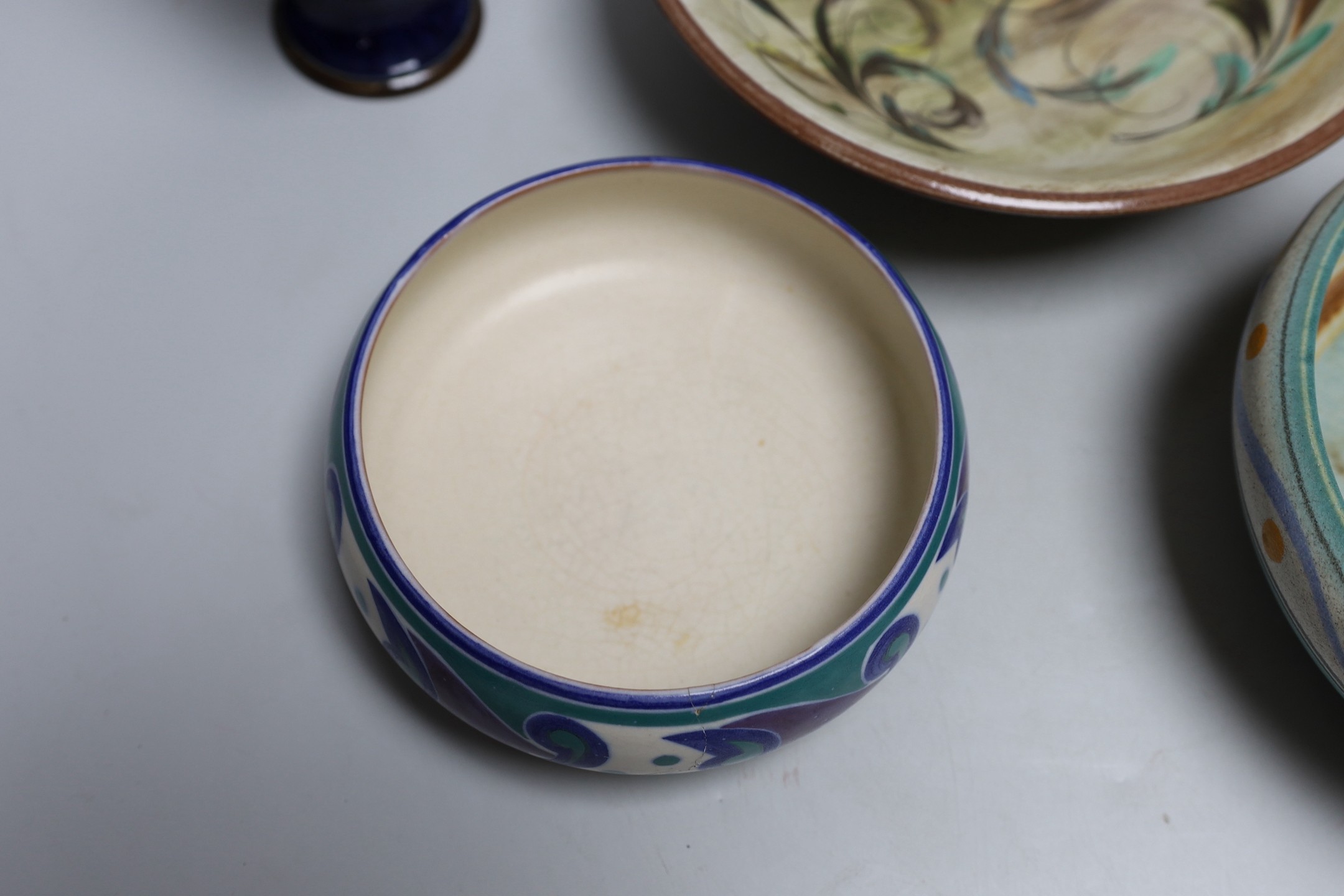 A Doulton stoneware vase and jug, tallest 28cm, together with three art ceramic bowls